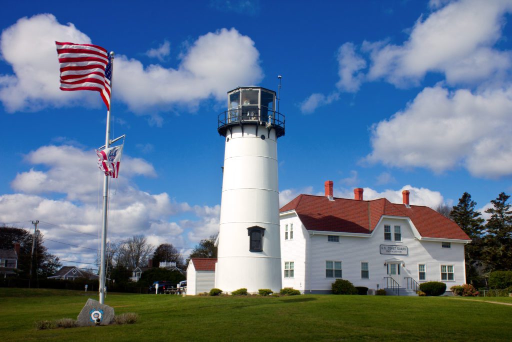 Lighthouse and flag pole in Chatham, MA